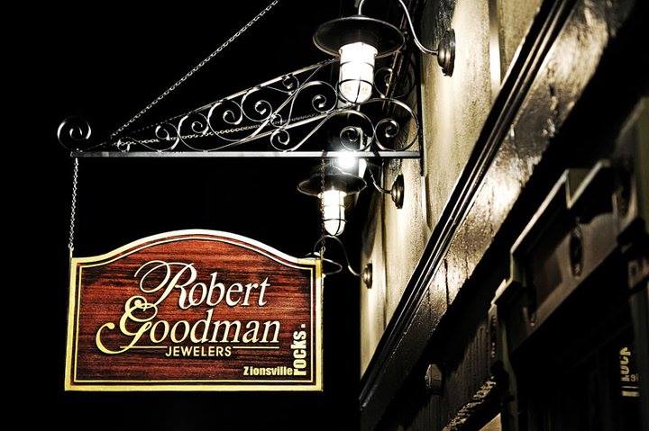 Robert Goodman Jewelers storefront sign at night